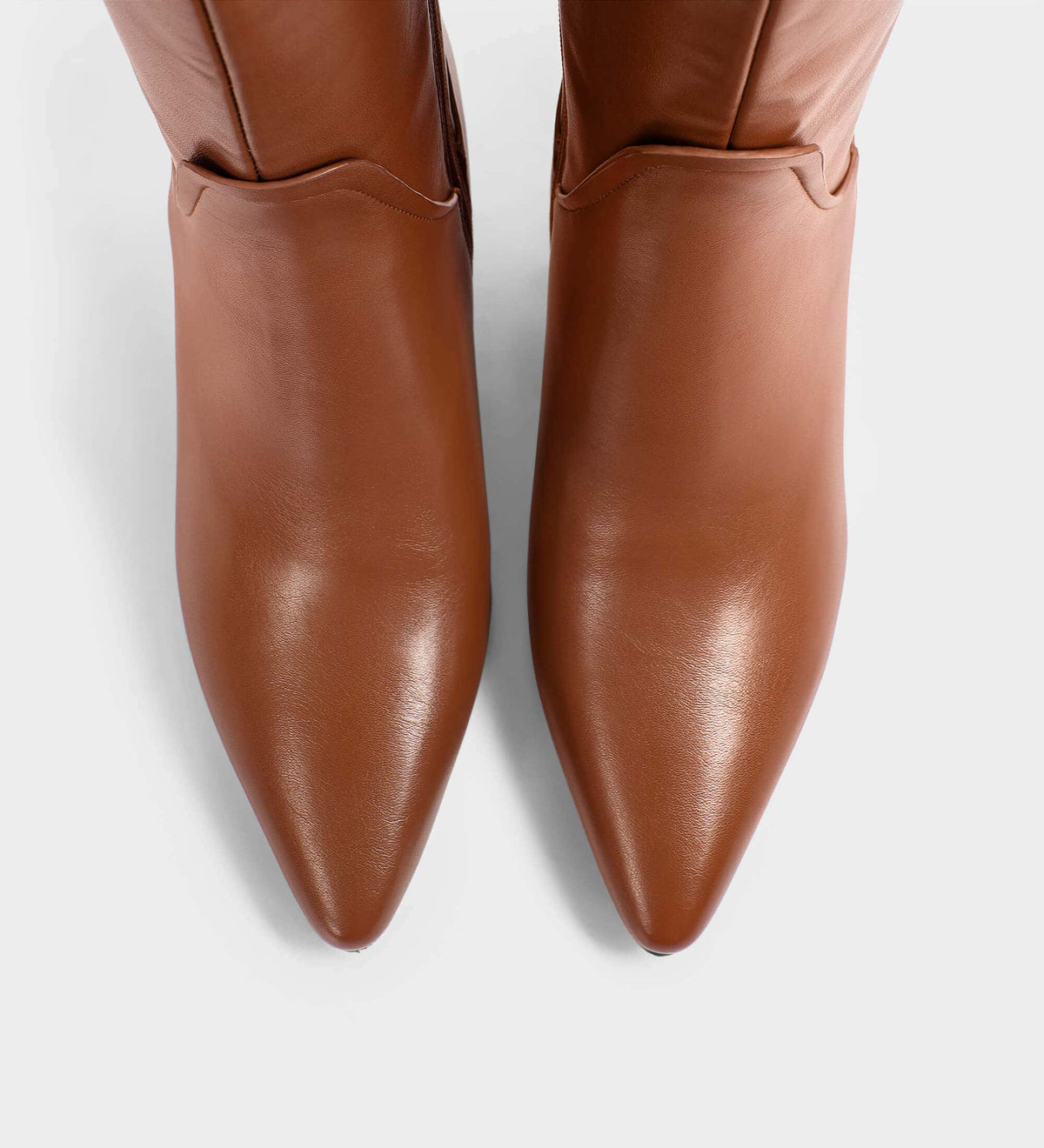 brown pointed toe boots​